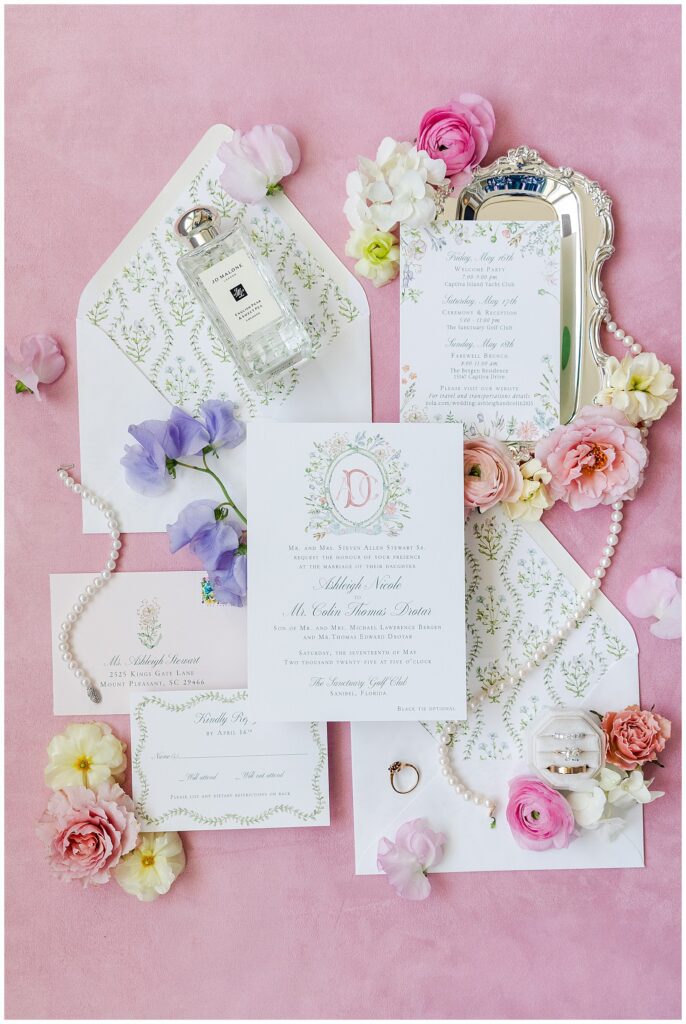 Pink wedding invitation flat lay