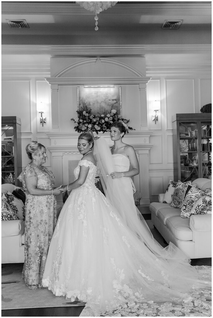 Bride getting into her wedding dress