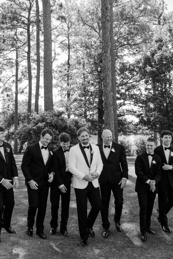 Lake and his groomsmen pose outdoors during the Steelwood Country Club wedding