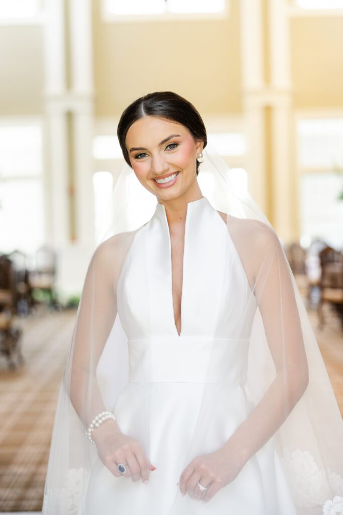 Bridal portrait of Grace in her classic white wedding gown and veil at Steelwood Country Club