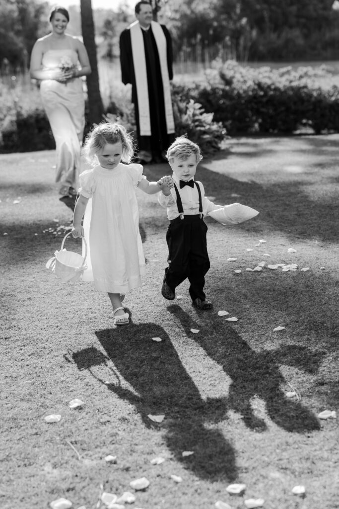 Flower girl and ring bearer walk down the aisle at Steelwood Country Club