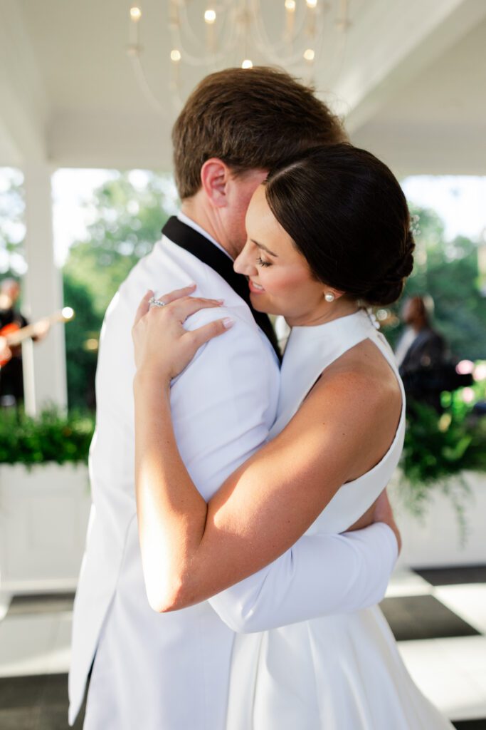 Grace and Lake embrace during the Steelwood Country Club reception