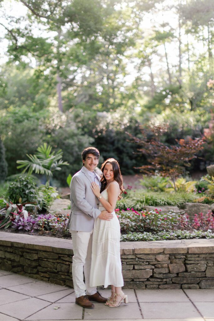 Emily and Brody pose together among colorful flowers at Birmingham Botanical Gardens.